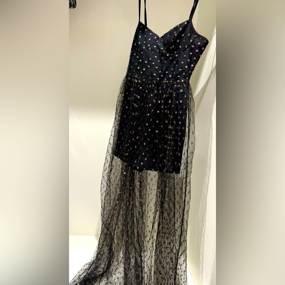 Black festival outfit with gold dot pattern